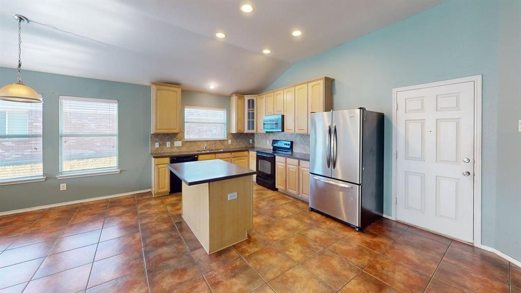 3251 Torio Grand Prairie, TX 75054 - Photo 4 of 23 a kitchen with stainless steel appliances granite countertop a refrigerator a stove a sink and a refrigerator