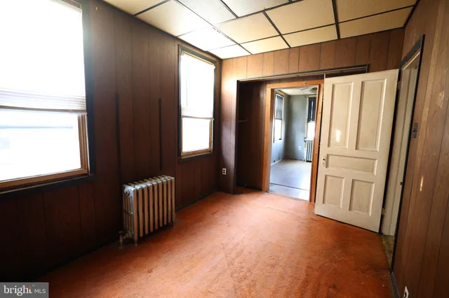 a view of an empty room with a fireplace