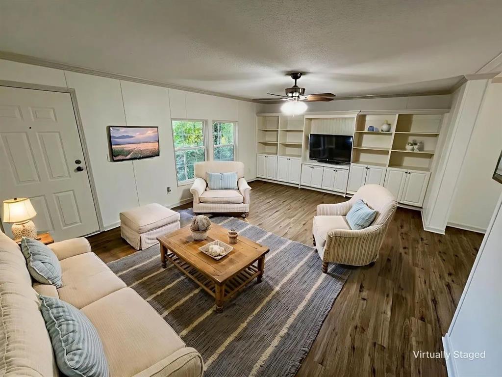 6913 Rice Road Shreveport, LA 71129 - Photo 5 of 26 a living room with furniture and a fireplace