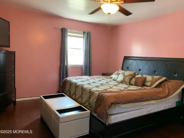 a bedroom with a bed and a desk