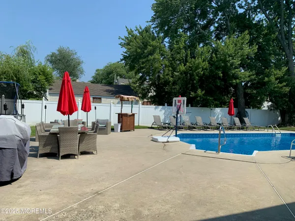 a view of a backyard with sitting area and furniture