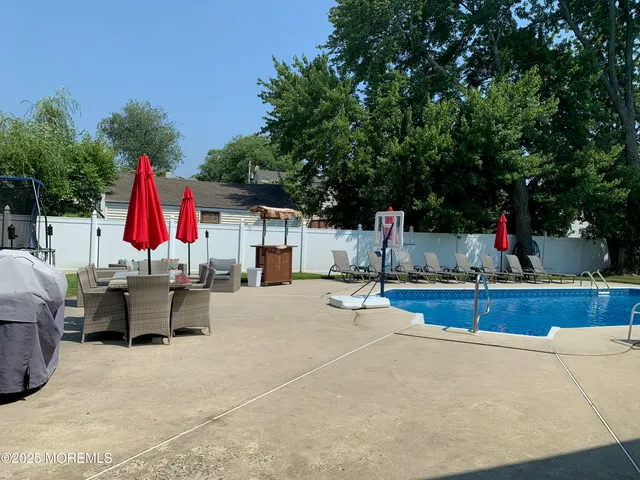 a view of a backyard with sitting area and furniture
