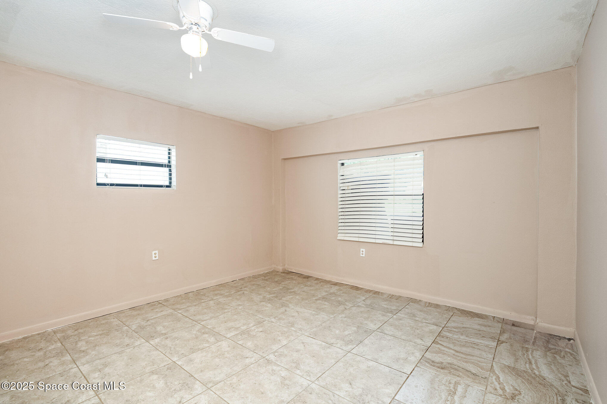 935 South Varr Avenue Rockledge, FL 32955 - Photo 13 of 29 a view of an empty room with a window