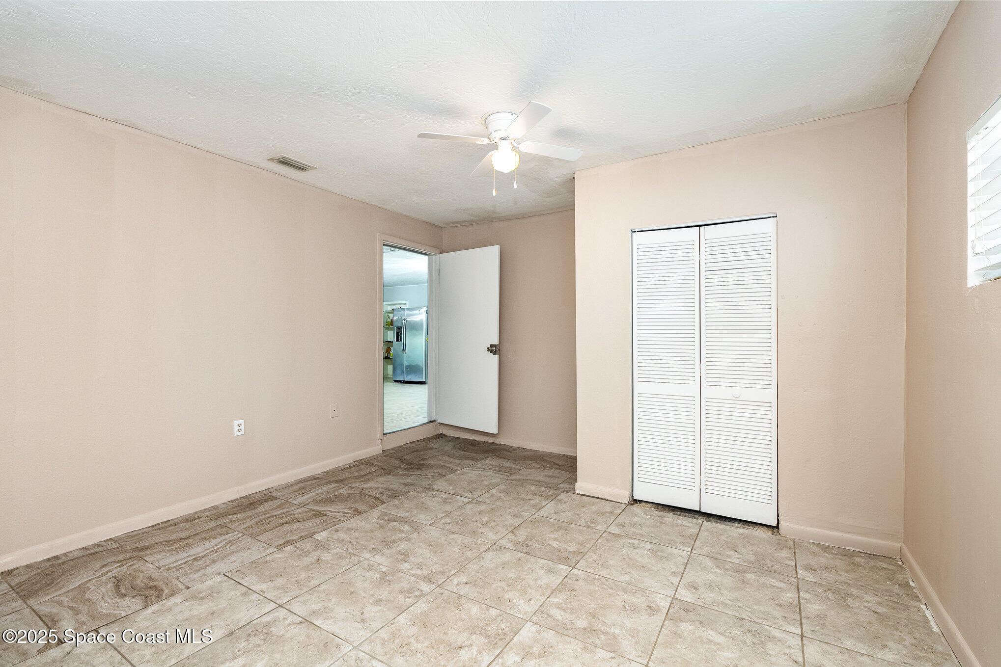 935 South Varr Avenue Rockledge, FL 32955 - Photo 14 of 29 an empty room with an entryway and shower