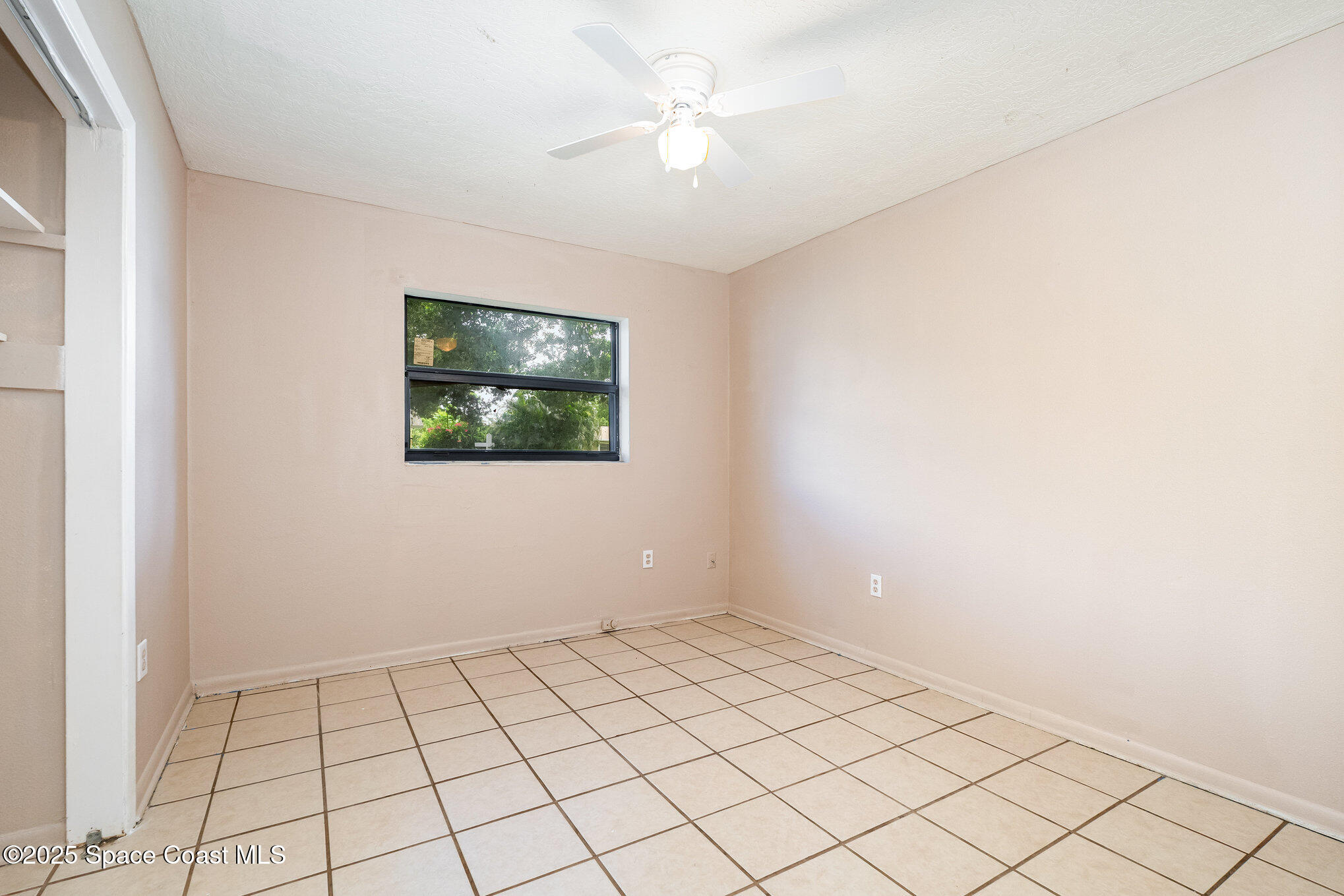 935 South Varr Avenue Rockledge, FL 32955 - Photo 15 of 29 a view of an empty room and window