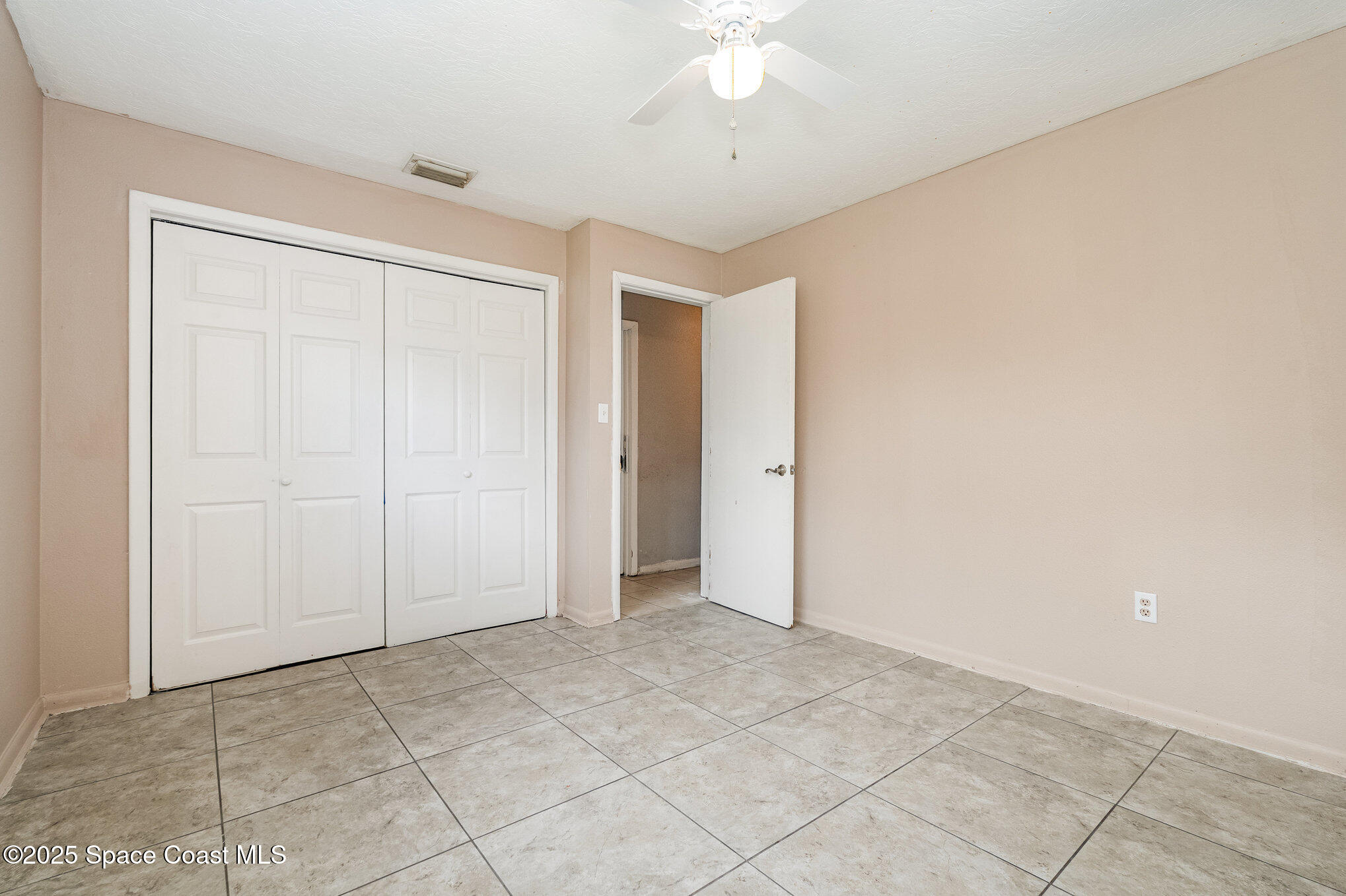 935 South Varr Avenue Rockledge, FL 32955 - Photo 18 of 29 an empty room with a ceiling fan