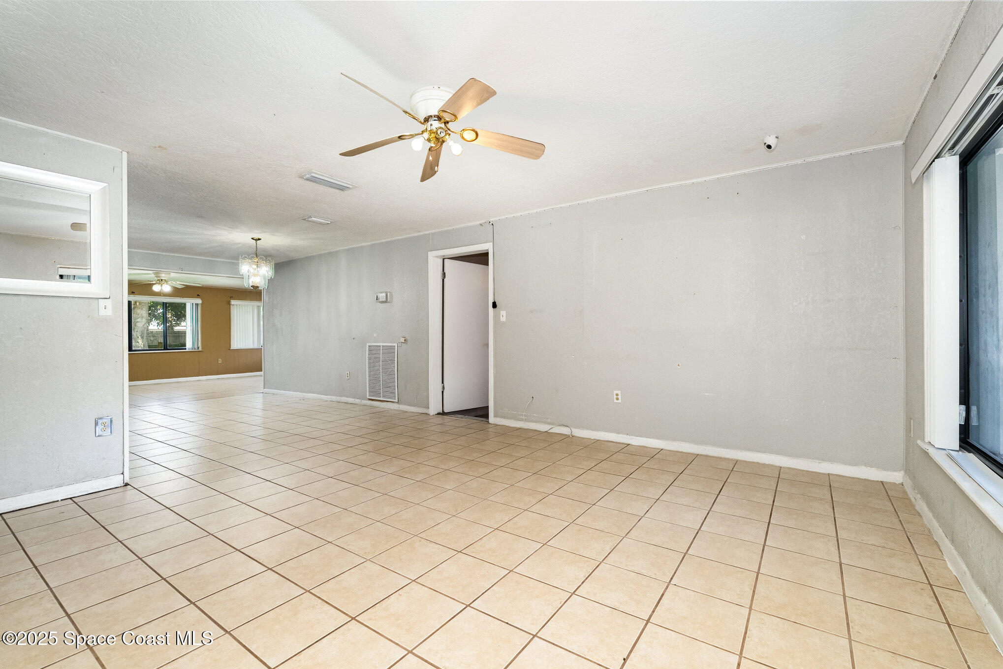 935 South Varr Avenue Rockledge, FL 32955 - Photo 6 of 29 a view of an empty room and window