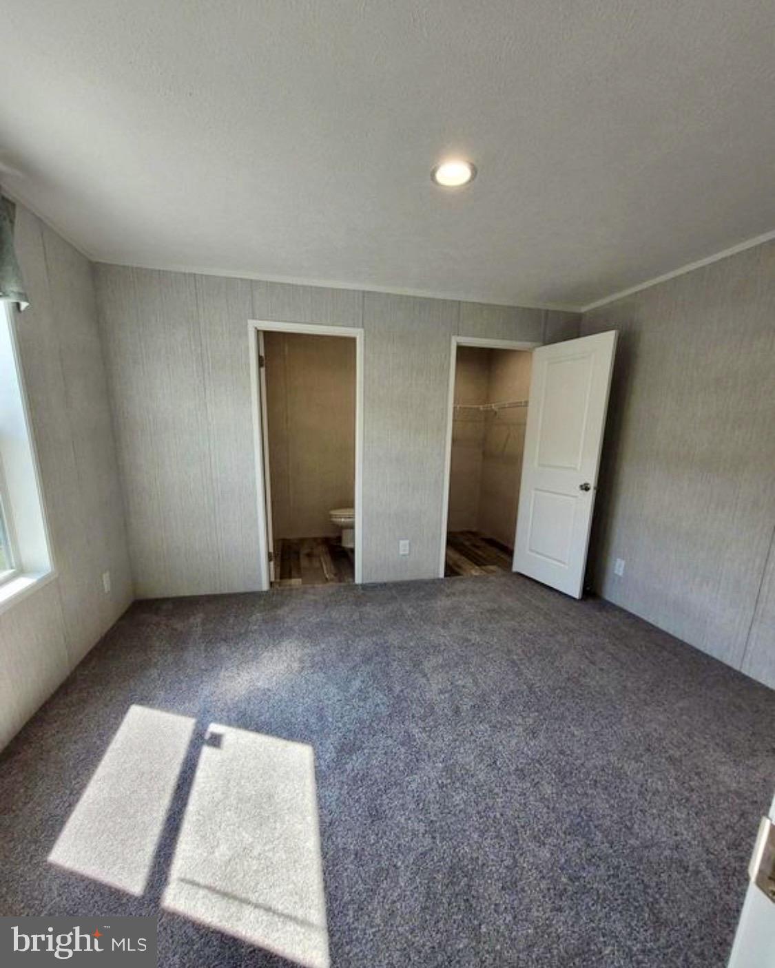 47 Hilltop Avenue Akron, PA 17501 - Photo 11 of 29 an empty room with a window and a fireplace