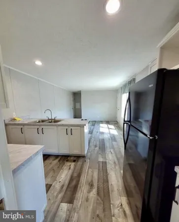 a view of cabinets and wooden floor