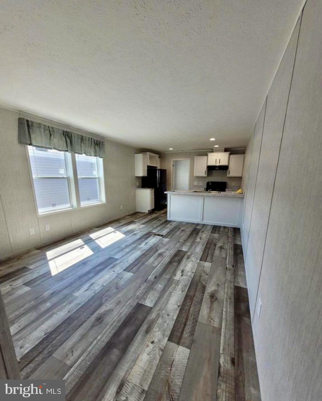47 Hilltop Avenue Akron, PA 17501 - Photo 18 of 29 a bedroom with a bed and wooden floor