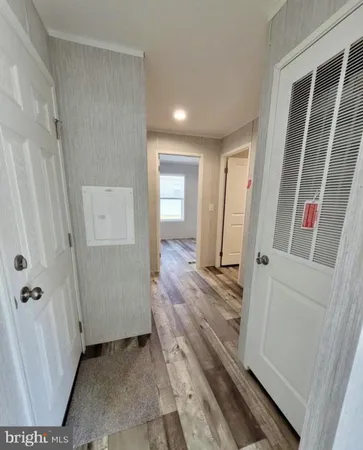 a view of a bathroom from a hallway