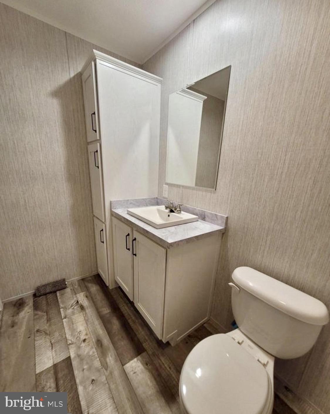 47 Hilltop Avenue Akron, PA 17501 - Photo 23 of 29 a white toilet sitting next to a bathroom sink