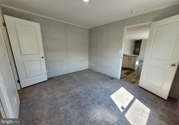 an empty room with a bench