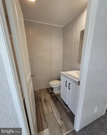 a bathroom with a toilet and a sink