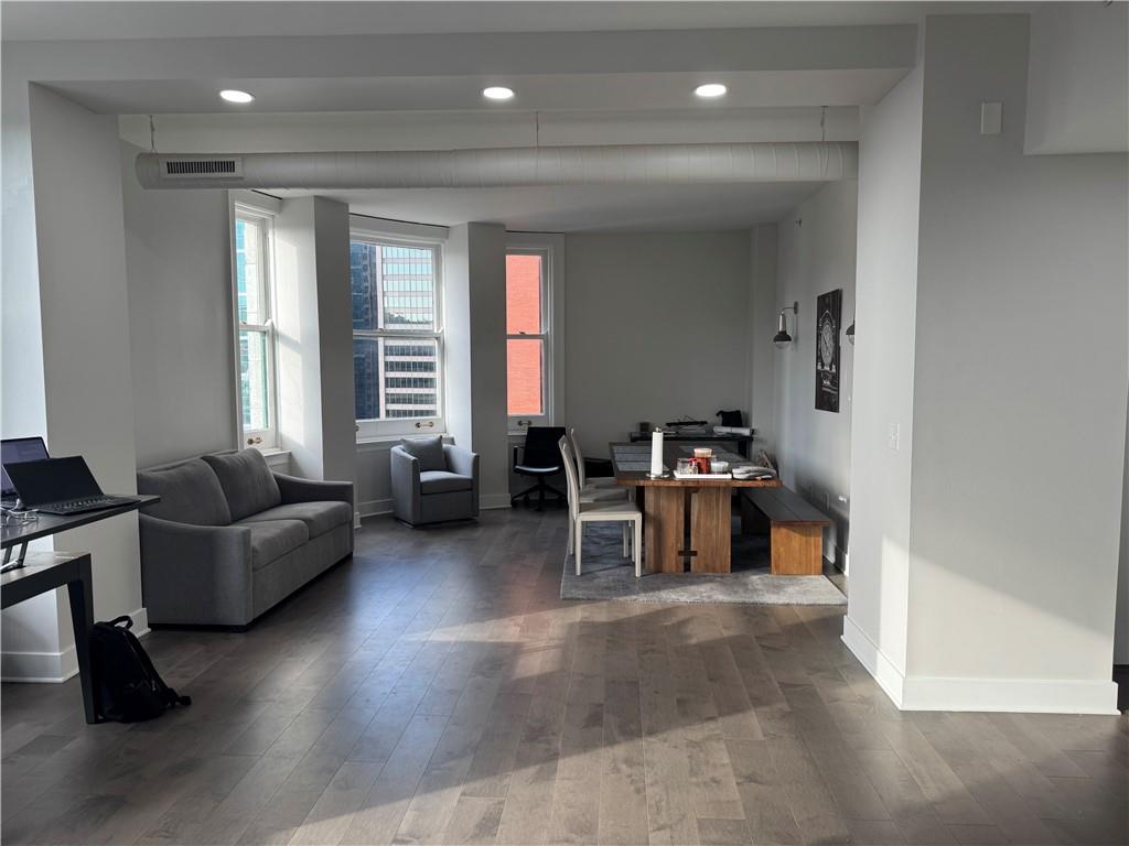 306 Fourth Avenue, Unit 1602 Pittsburgh, PA 15222 - Photo 13 of 31 a living room with furniture and a large window