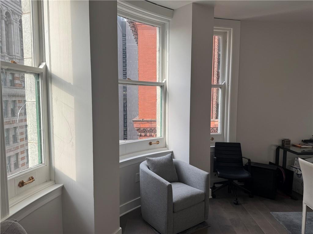 306 Fourth Avenue, Unit 1602 Pittsburgh, PA 15222 - Photo 14 of 31 a living room with furniture and a window