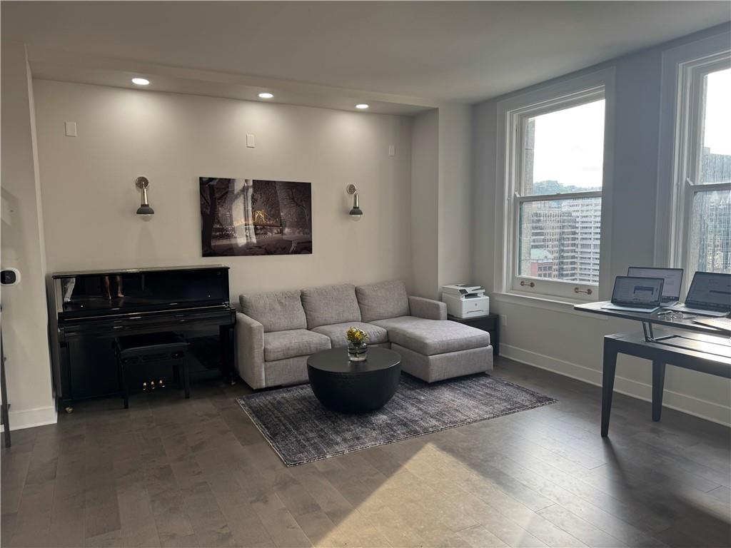 306 Fourth Avenue, Unit 1602 Pittsburgh, PA 15222 - Photo 15 of 31 a living room with furniture and a flat screen tv