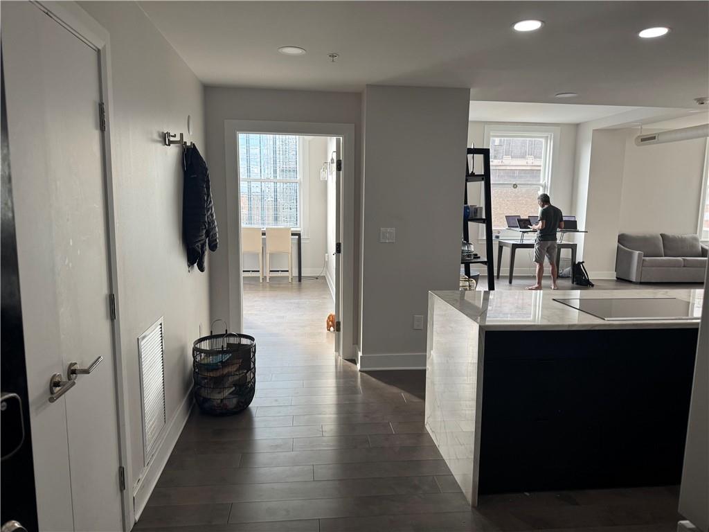 306 Fourth Avenue, Unit 1602 Pittsburgh, PA 15222 - Photo 9 of 31 a kitchen with kitchen island a sink stainless steel appliances and counter space