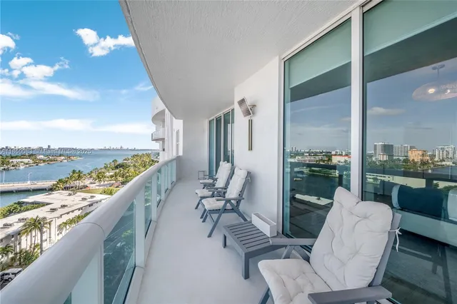 a balcony with furniture and city view