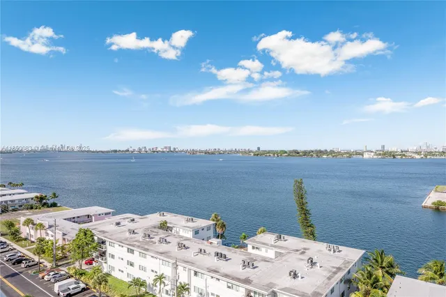 a view of a terrace with a table and chairs