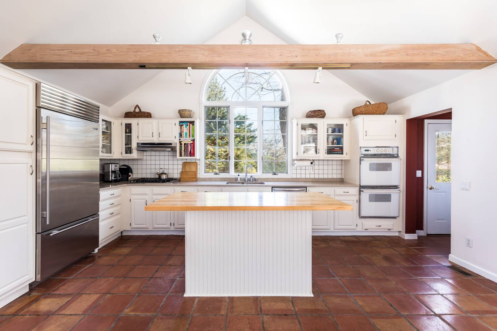 40 Williams Way Bridgehampton, NY 11932 - Photo 9 of 17 a kitchen with stainless steel appliances granite countertop a refrigerator and a sink