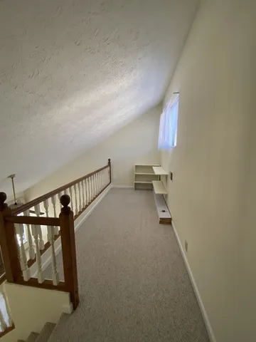a view of a hallway with staircase