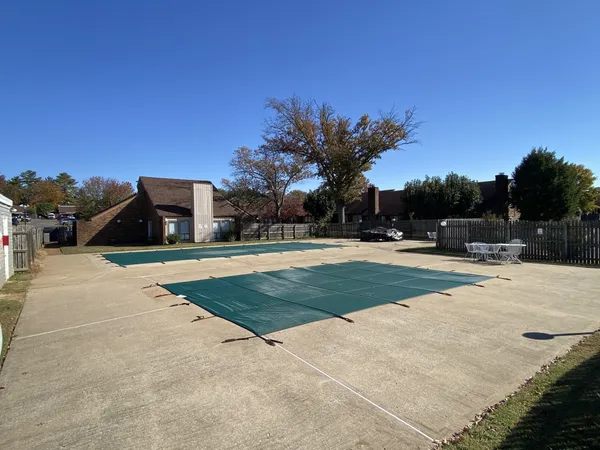 a view of swimming pool with a yard