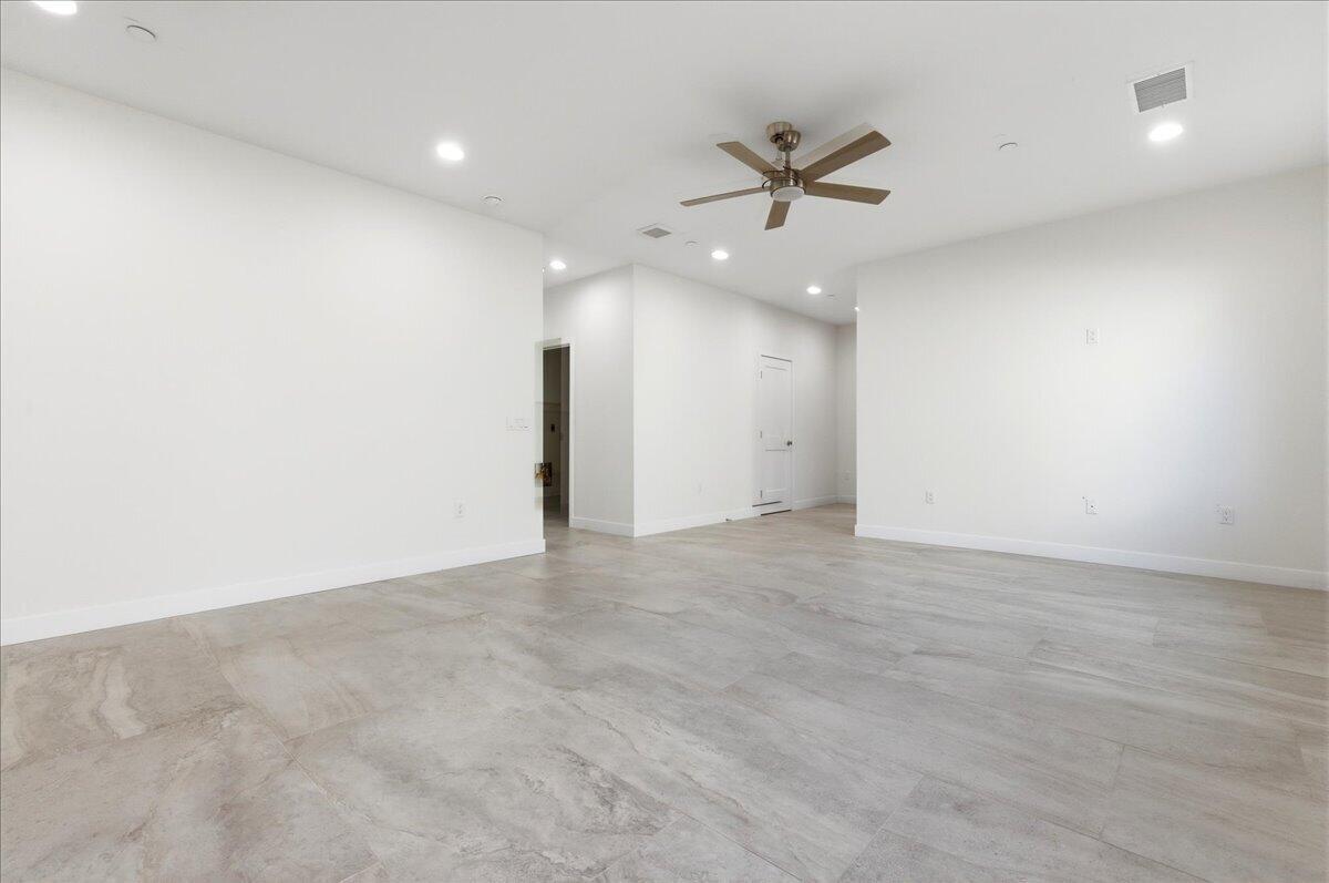 68160 Modalo Road Cathedral City, CA 92234 - Photo 9 of 57 an empty room with ceiling fan and window