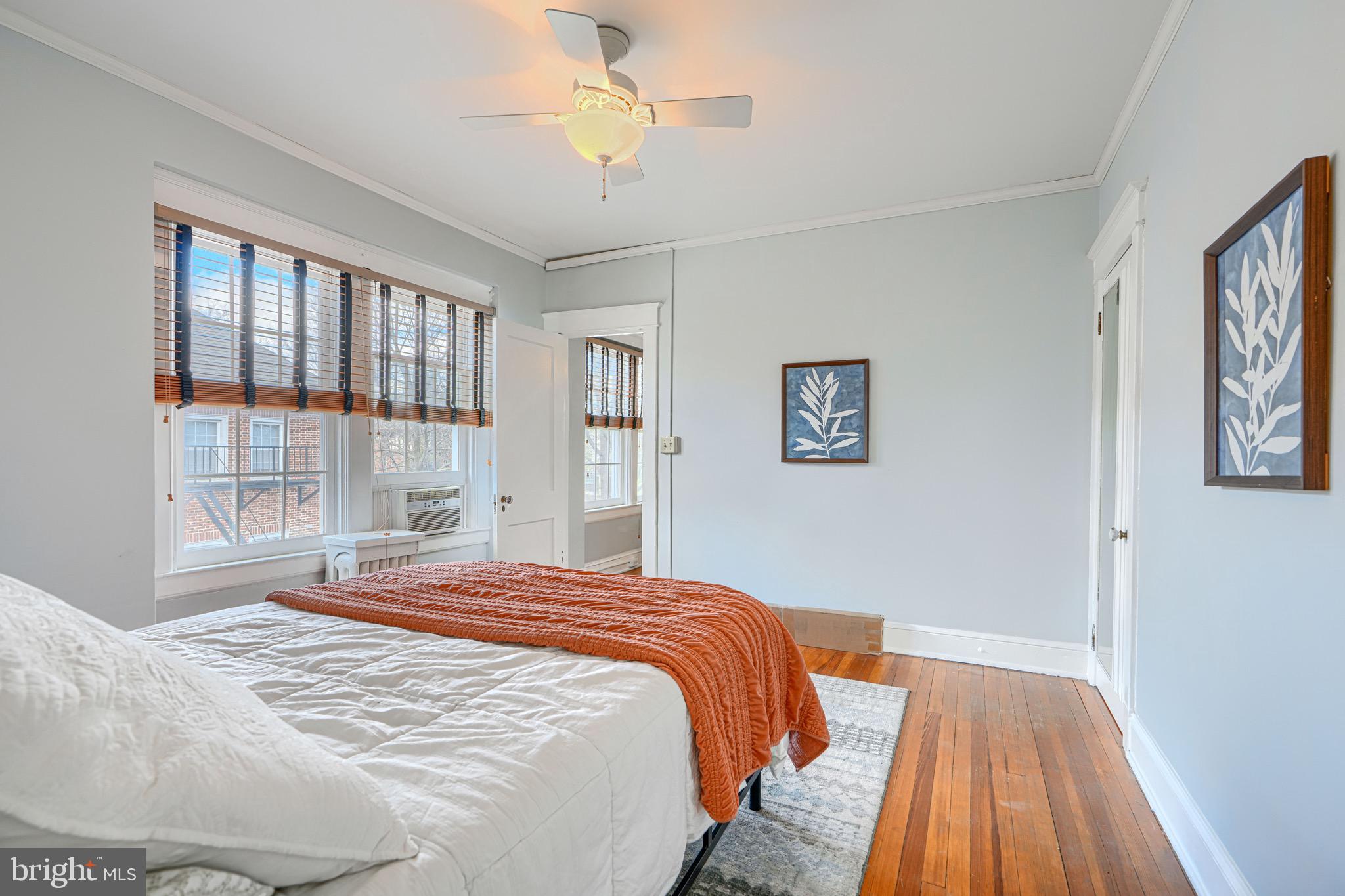 607 Somerset Road, Unit 5 Baltimore, MD 21210 - Photo 20 of 38 a bedroom with a large bed and a window