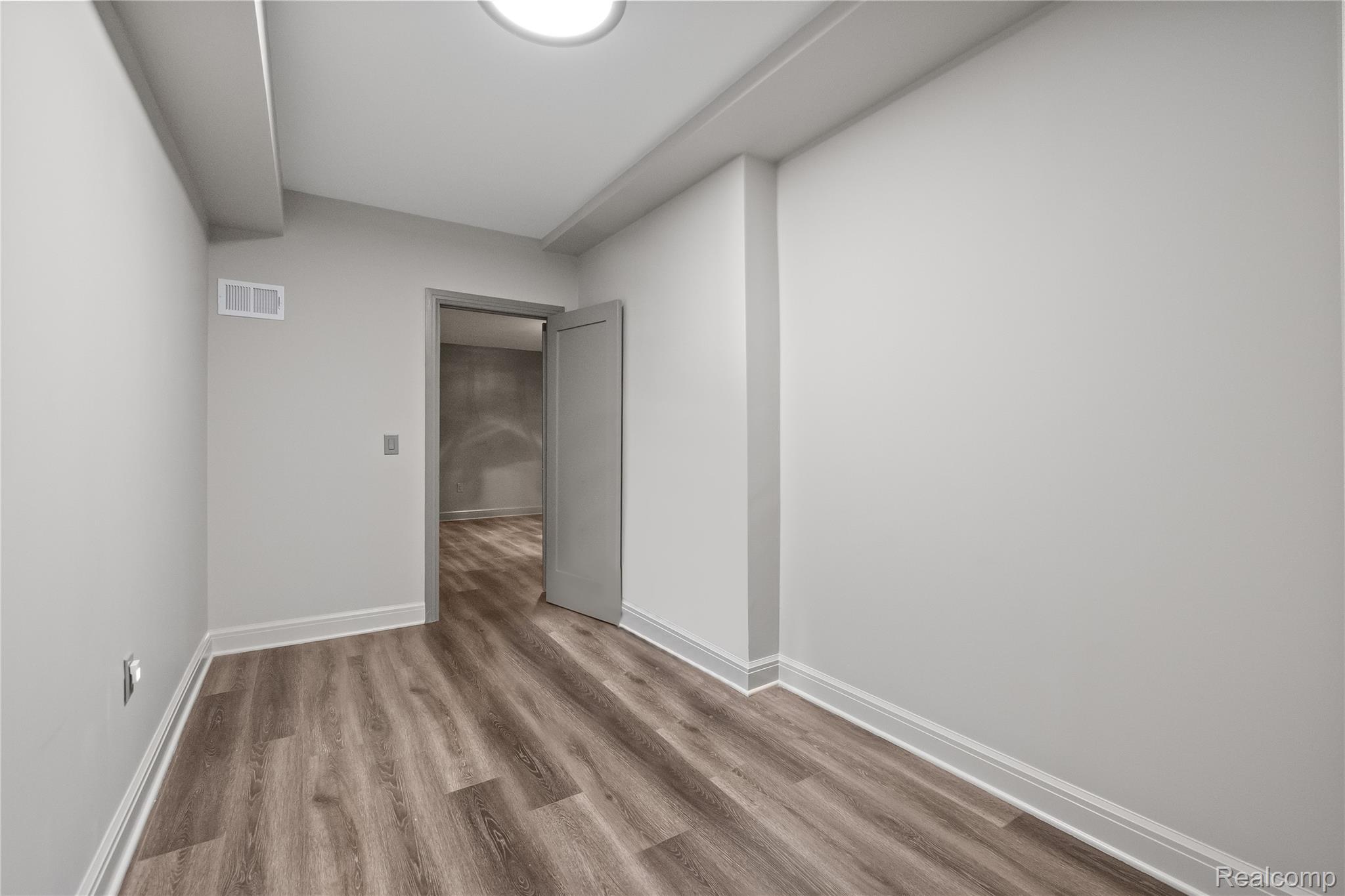 3824 Poppleton Street Troy, MI 48084 - Photo 40 of 51 Spare room featuring wood finished floors and baseboards