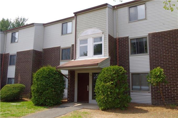 7 Padanaram Road, Unit 187 Danbury, CT 06811 - Photo 1 of 1 a front view of a house with garden