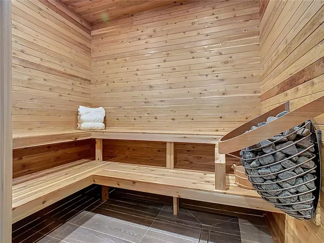 a room with pool table and windows