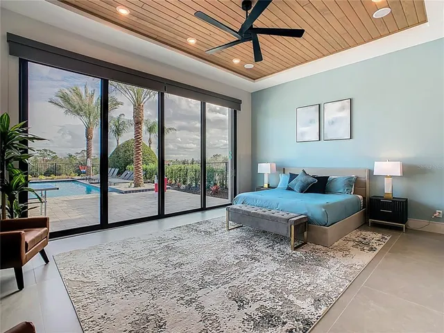 a bedroom with a bed and a table in it