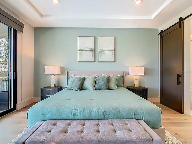 a view of an outdoor dining space with a table and chairs