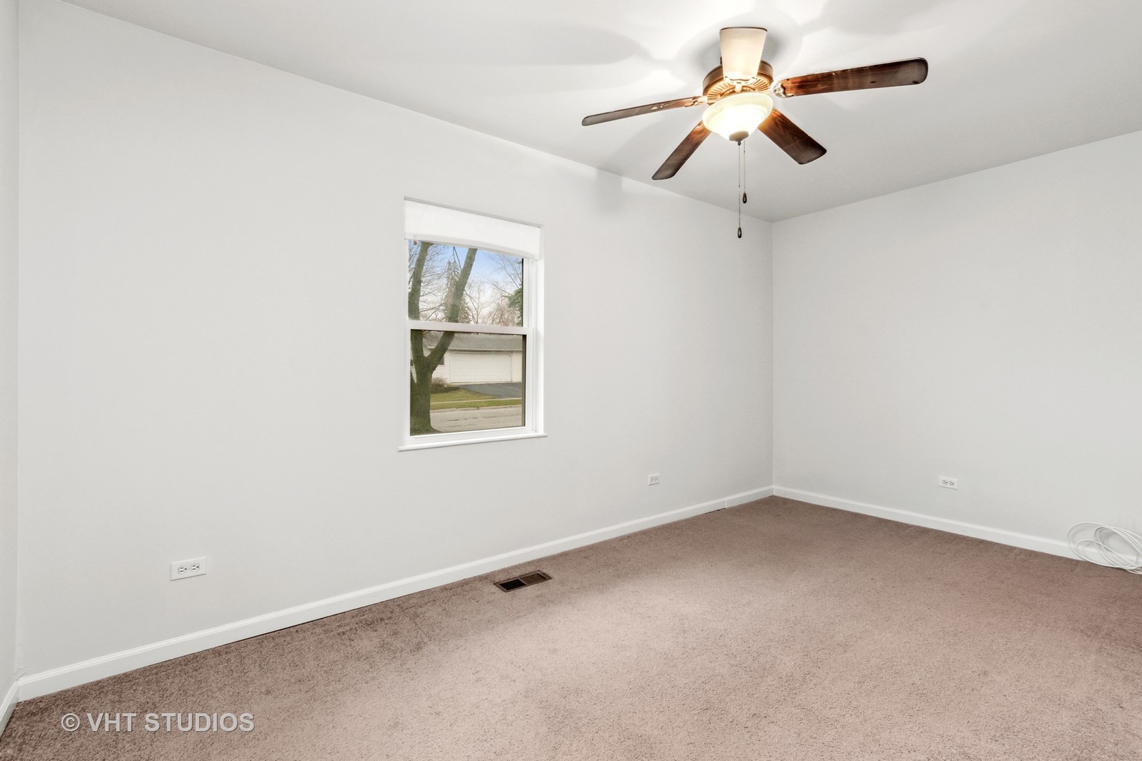 22202 Rockingham Road Richton Park, IL 60471 - Photo 8 of 12 an empty room with a window and a fan