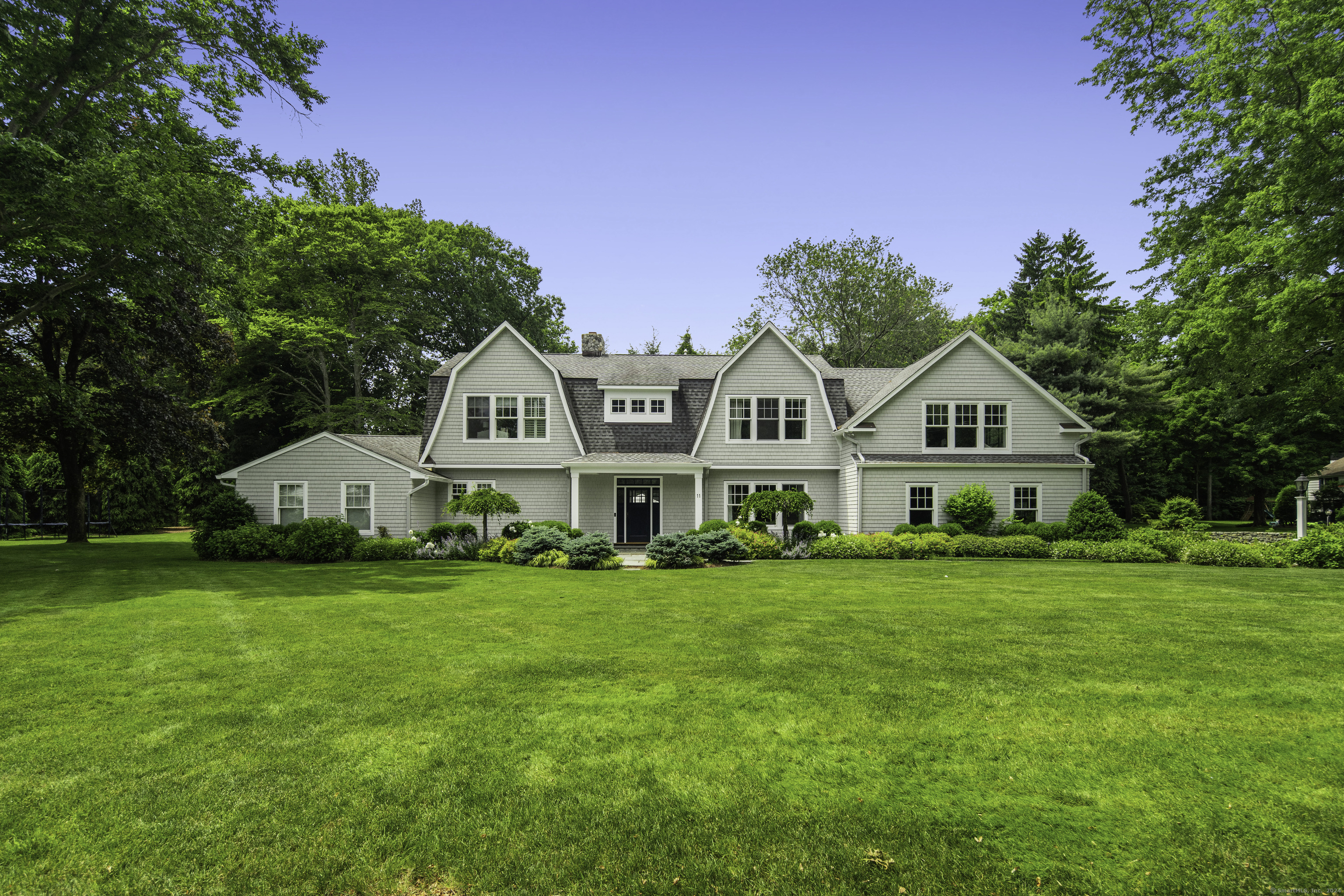 11 Linda Lane Darien, CT 06820 - Photo 1 of 1 a front view of a house with a garden