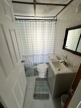 a view of an empty room and a window