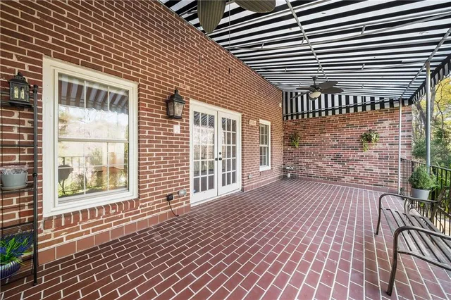 a view of a porch with wooden floor
