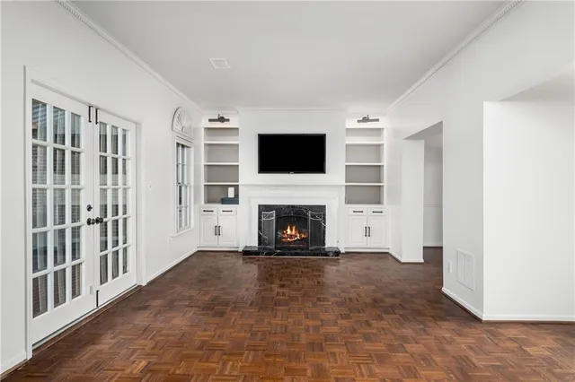 a view of a livingroom with a fireplace and a window
