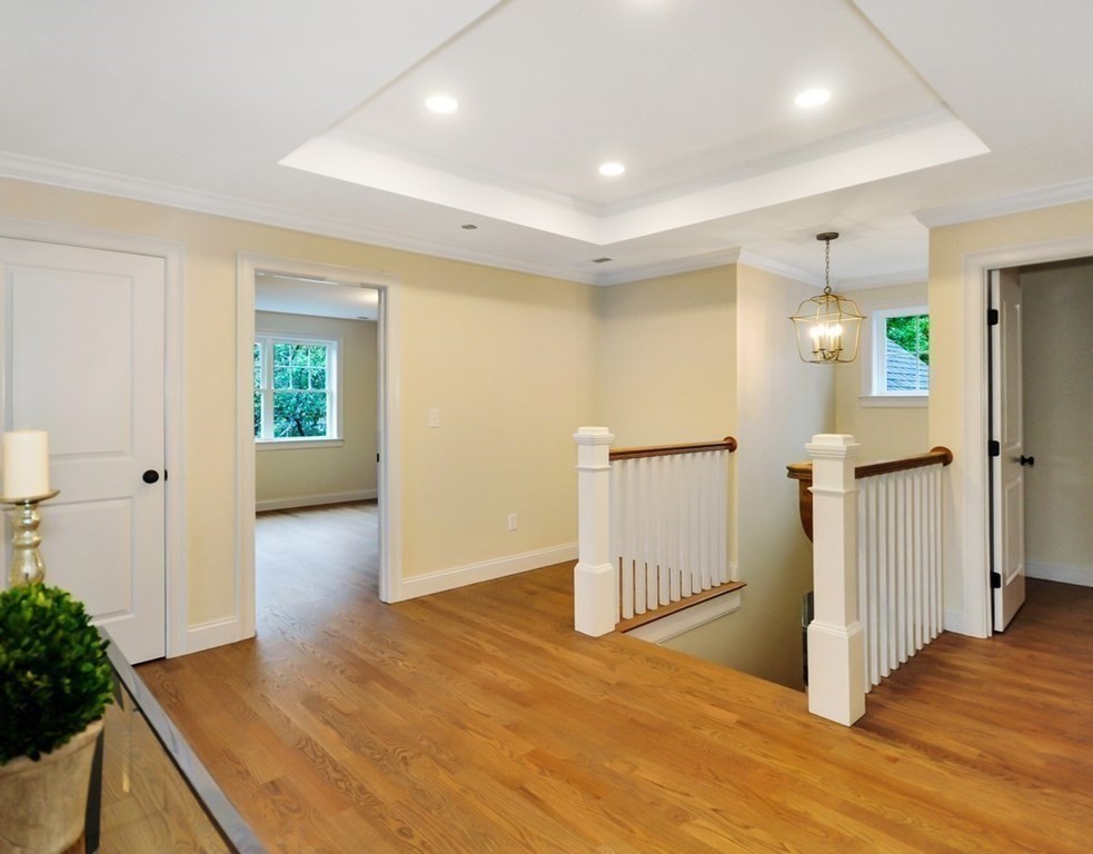 174 Wright Road Concord, MA 01742 - Photo 17 of 35 a view of a hallway with wooden floor and entryway