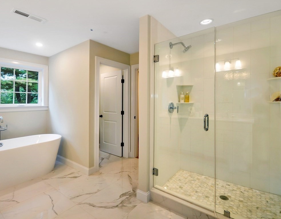 174 Wright Road Concord, MA 01742 - Photo 20 of 35 a bathroom with a bathtub and shower