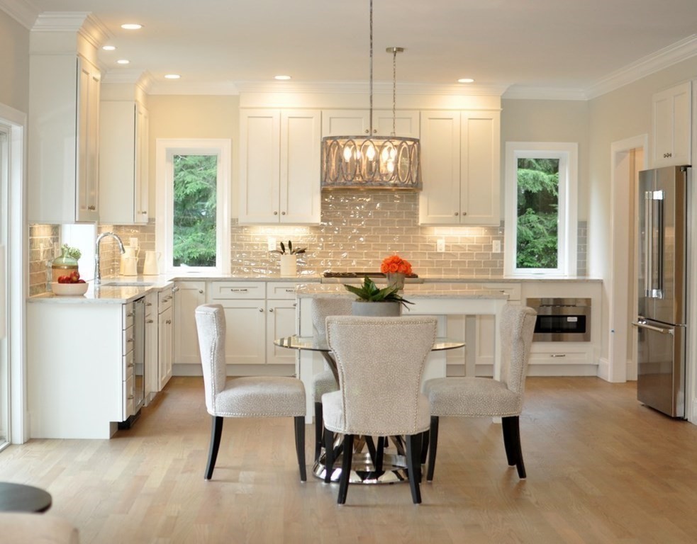 174 Wright Road Concord, MA 01742 - Photo 2 of 35 a dining room with furniture a large window and kitchen view