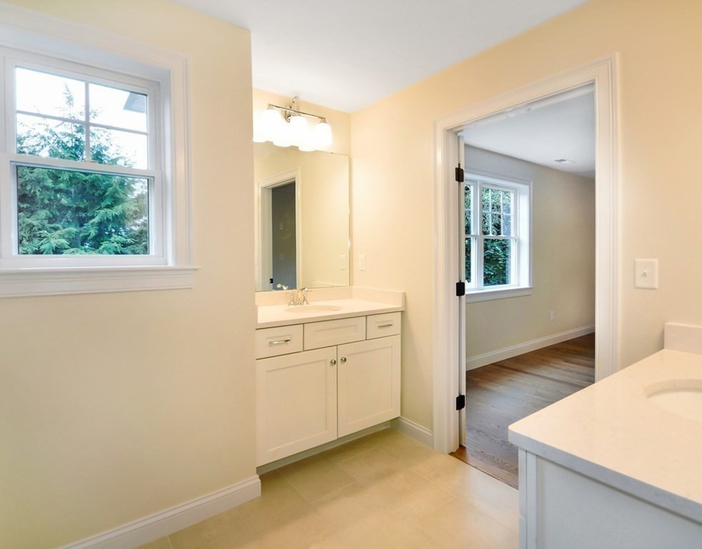 174 Wright Road Concord, MA 01742 - Photo 23 of 35 a bathroom with a sink a vanity and a mirror