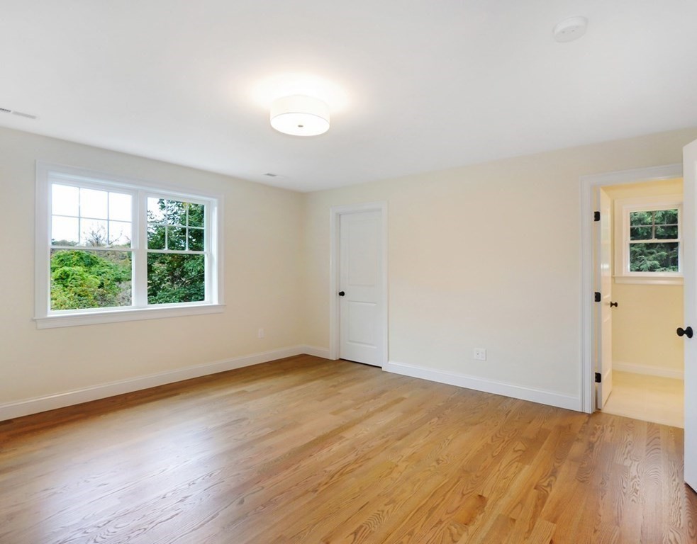 174 Wright Road Concord, MA 01742 - Photo 24 of 35 an empty room with wooden floor and windows