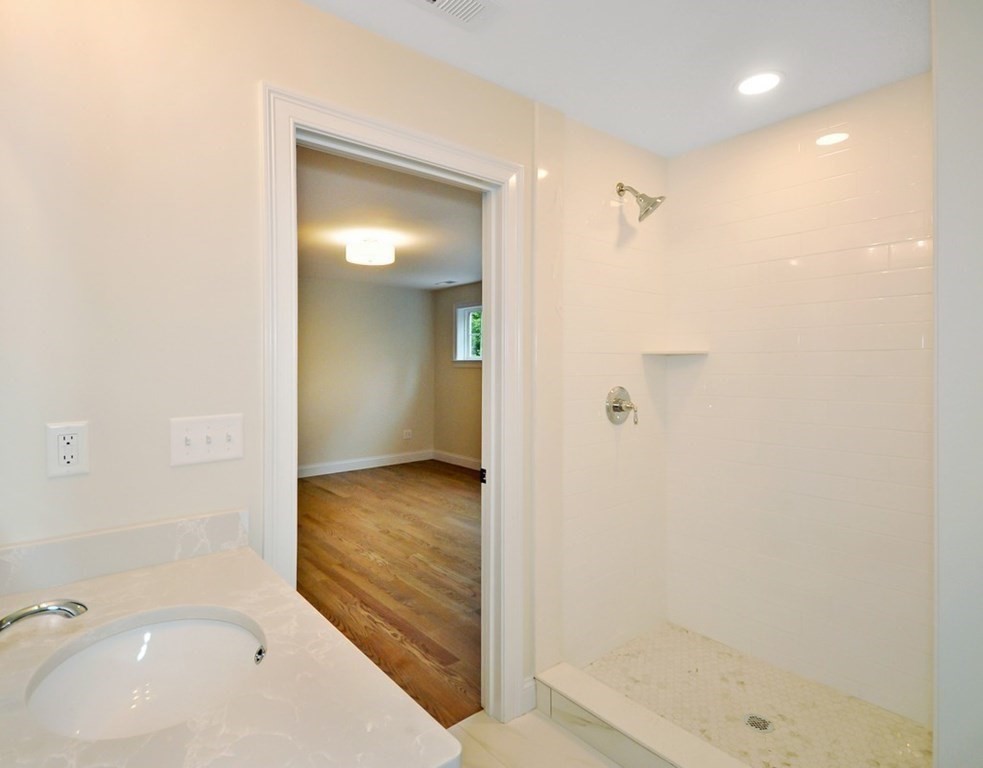 174 Wright Road Concord, MA 01742 - Photo 25 of 35 a bathroom with a tub shower and sink