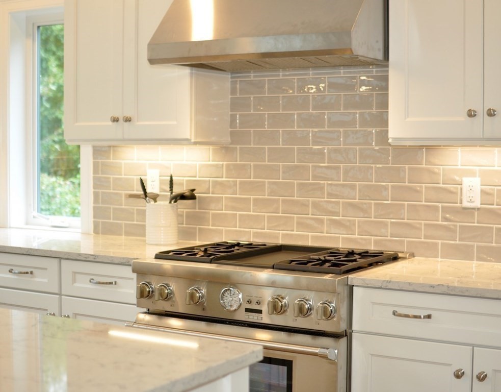 174 Wright Road Concord, MA 01742 - Photo 28 of 35 a kitchen with granite countertop a stove and cabinets
