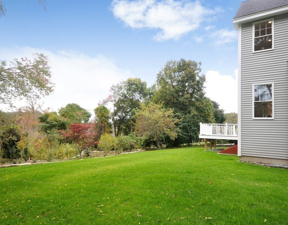 174 Wright Road Concord, MA 01742 - Photo 34 of 35 a view of a backyard with large trees