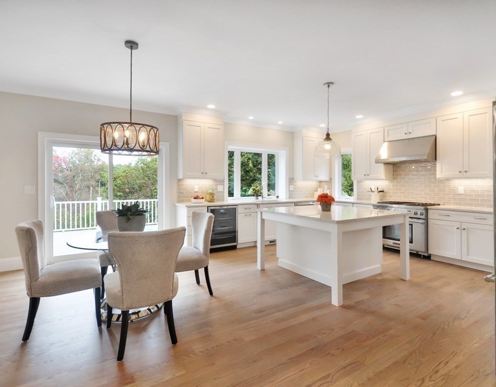 174 Wright Road Concord, MA 01742 - Photo 4 of 35 a view of kitchen with dining table chairs and wooden floor