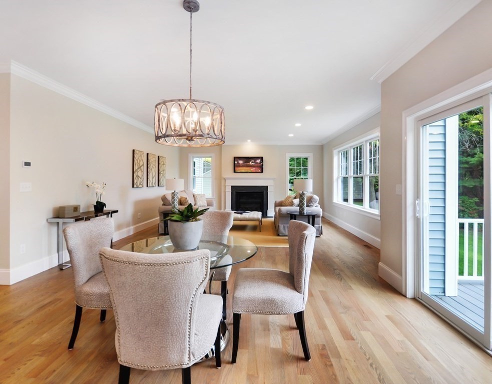 174 Wright Road Concord, MA 01742 - Photo 6 of 35 a view of a dining room with furniture wooden floor and chandelier