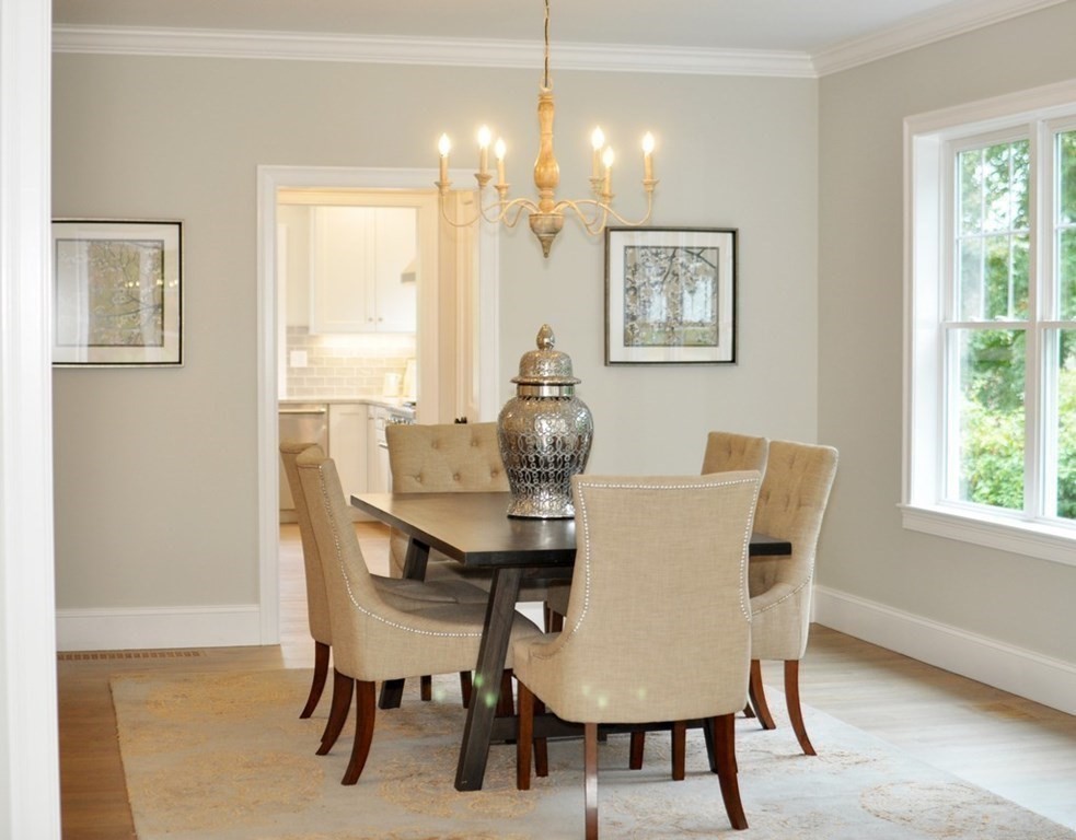 174 Wright Road Concord, MA 01742 - Photo 10 of 35 a view of a dining room with furniture and chandelier